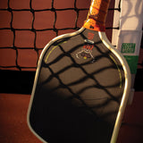 Close-up of the edge guard and bumper on the Bread & Butter Loco 16mm Standard pickleball paddle