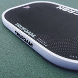 Close-up of the edge guard and bumper on the CRBN TruFoam Genesis 2 pickleball paddle