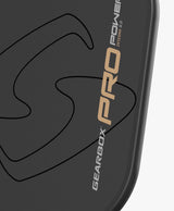 Macro view of the Solid-span carbon face texture on the Gearbox Pro Integra Power 16 that generates its spin